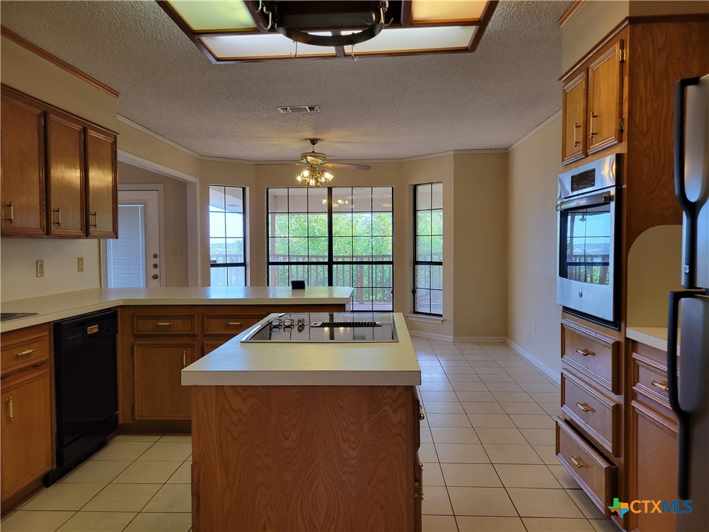 1511 Wild Ridge Drive Harker Heights, TX 76548 - Photo 9 of 29 a kitchen with furniture a counter top space and stainless steel appliances