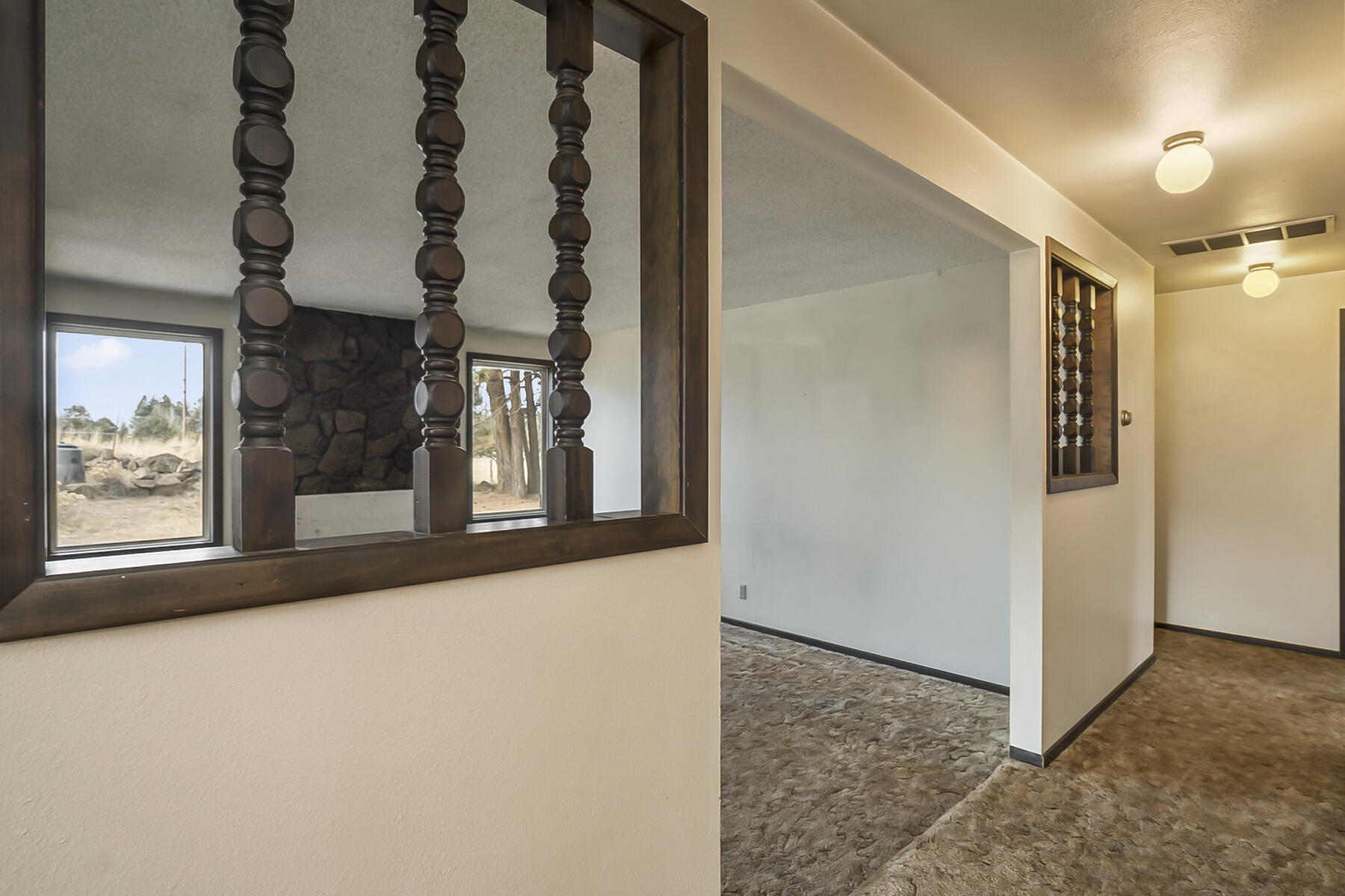 61825 Dobbin Road Bend, OR 97702 - Photo 13 of 43 a view of a hallway with windows
