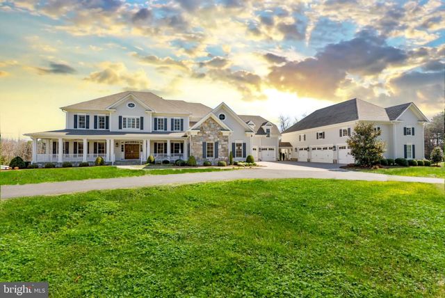 a front view of building with yard and green space