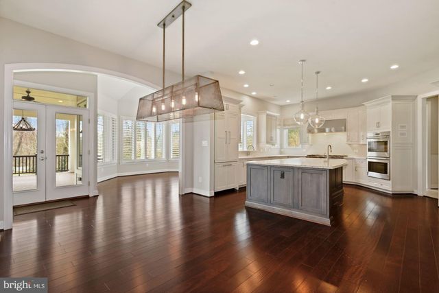 a kitchen with a sink stainless steel appliances and cabinets