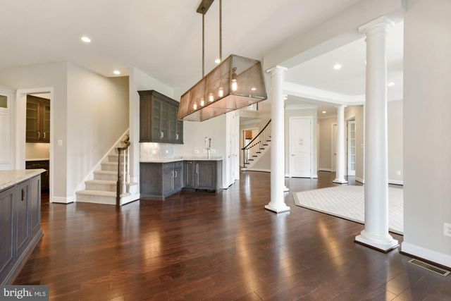 a view of an empty room with a fireplace and a window