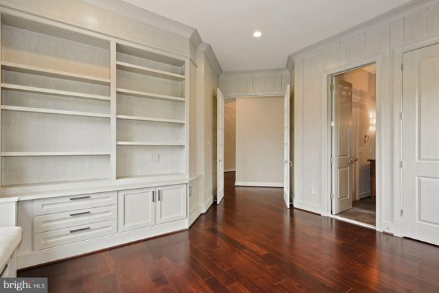 a view of a hallway with washer and dryer