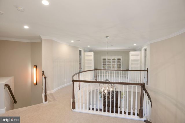 a spacious bathroom with a tub shower and mirror