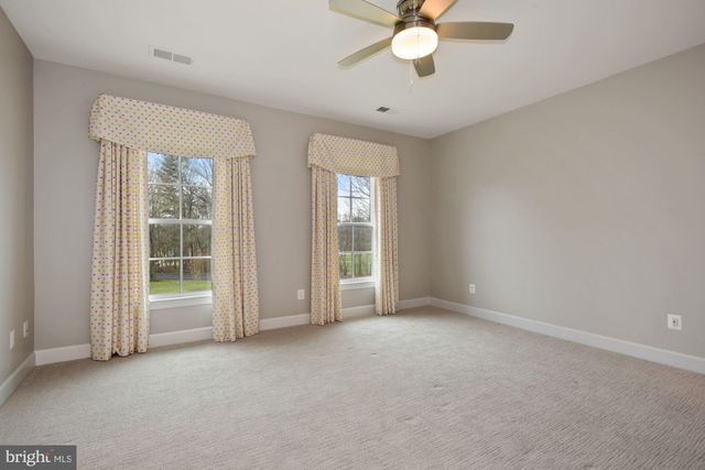 a kitchen with granite countertop a sink and a microwave