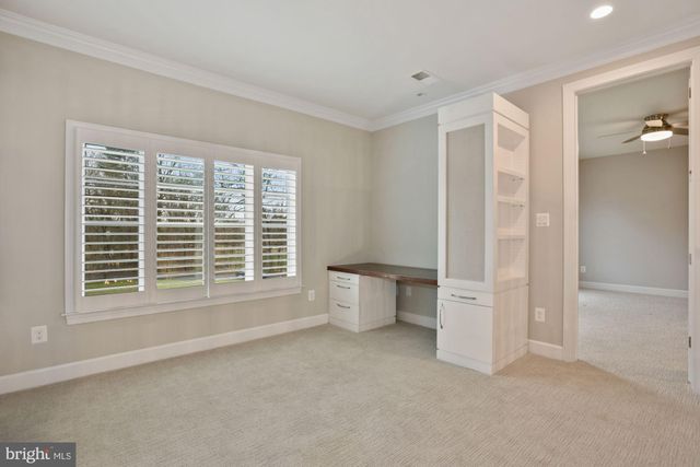 a kitchen with a refrigerator and a sink