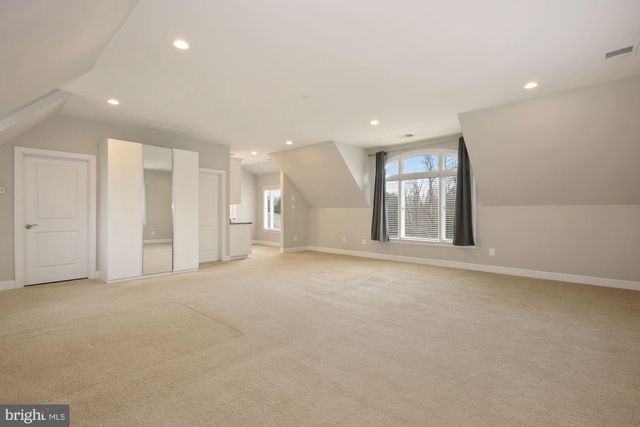 a living room with fireplace and a flat screen tv