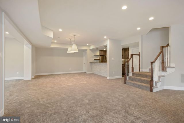 an empty room with a empty space and a ceiling fan