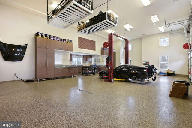 an aerial view of a house with a big yard
