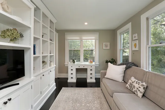 a living room with furniture fireplace and a flat screen tv