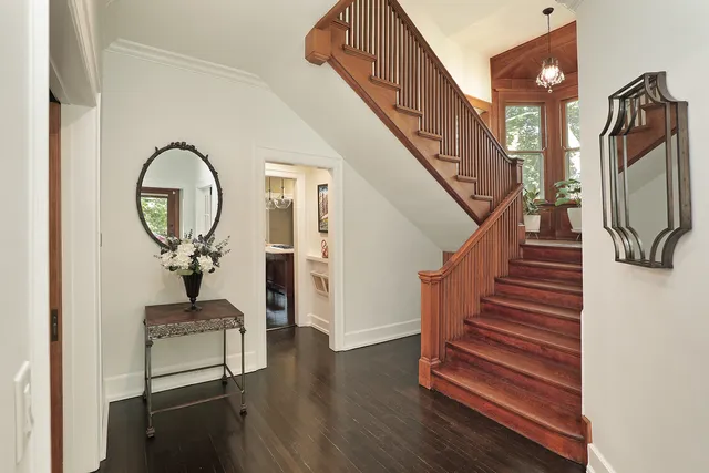 a view of entryway and hall with wooden floor