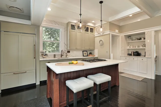 a kitchen with a table and chairs in it