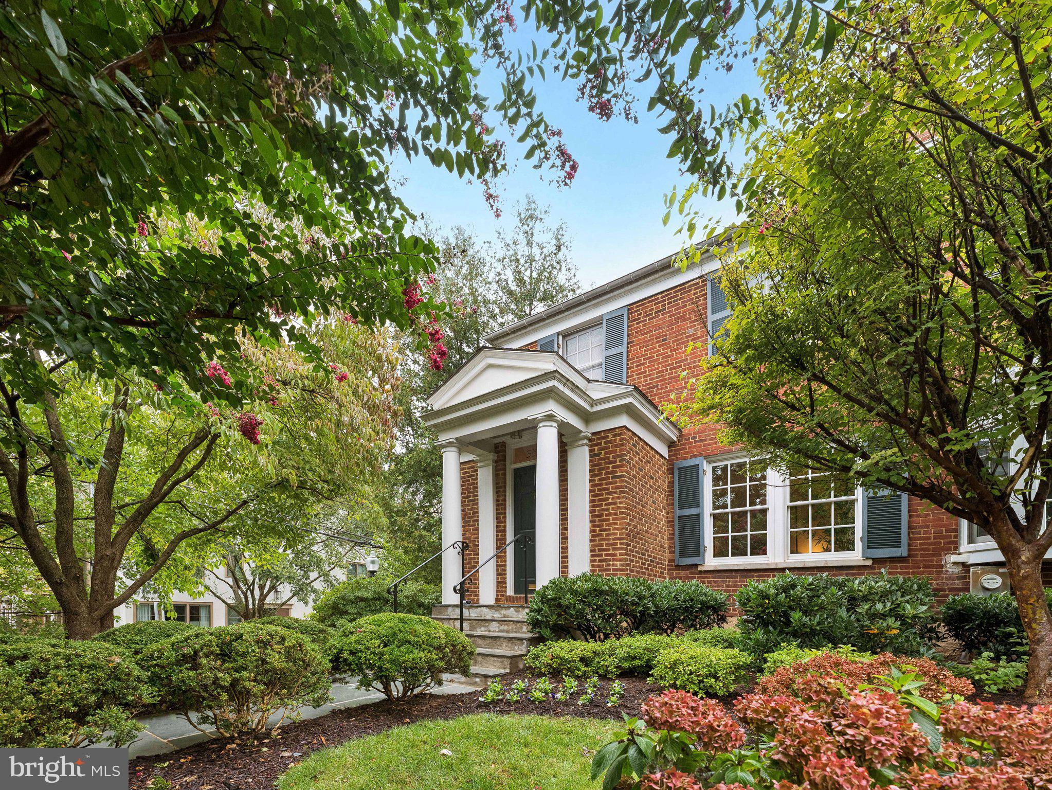 front view of a house with a tree