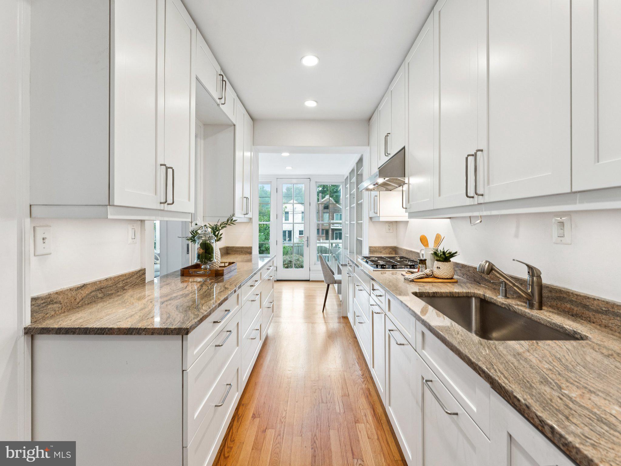 3541 R Street Northwest Washington, DC 20007 - Photo 15 of 35 a kitchen with granite countertop a sink and cabinets