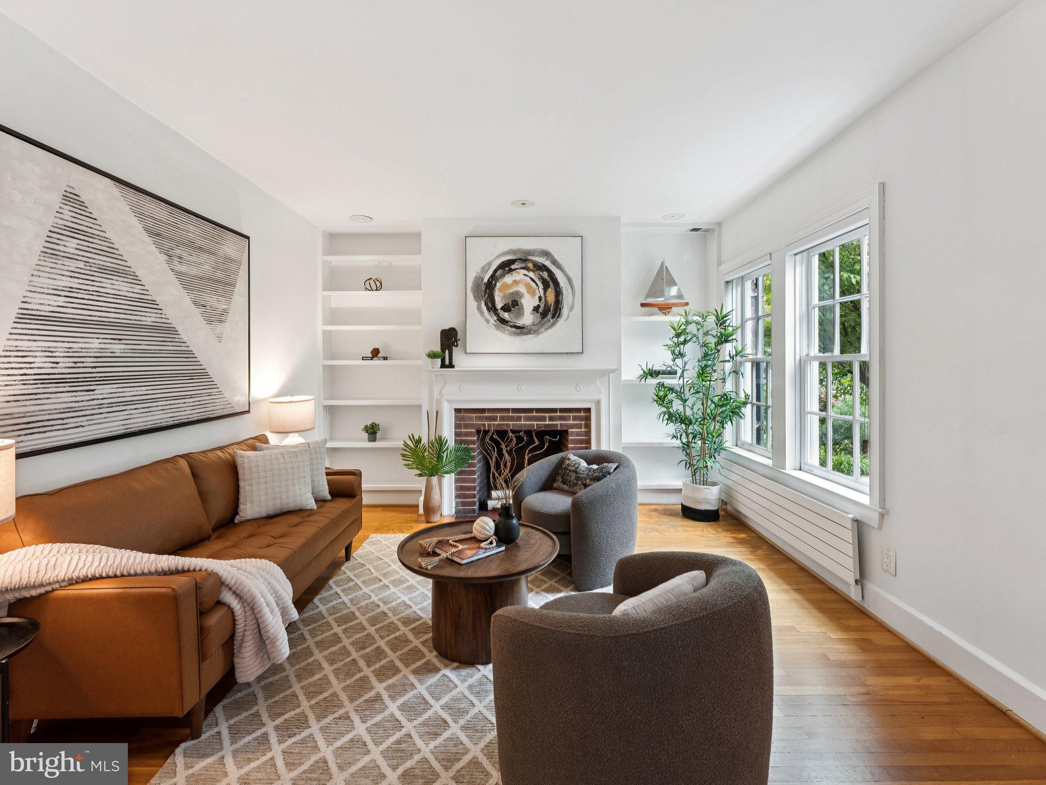 3541 R Street Northwest Washington, DC 20007 - Photo 2 of 35 a living room with furniture a fireplace and a large window