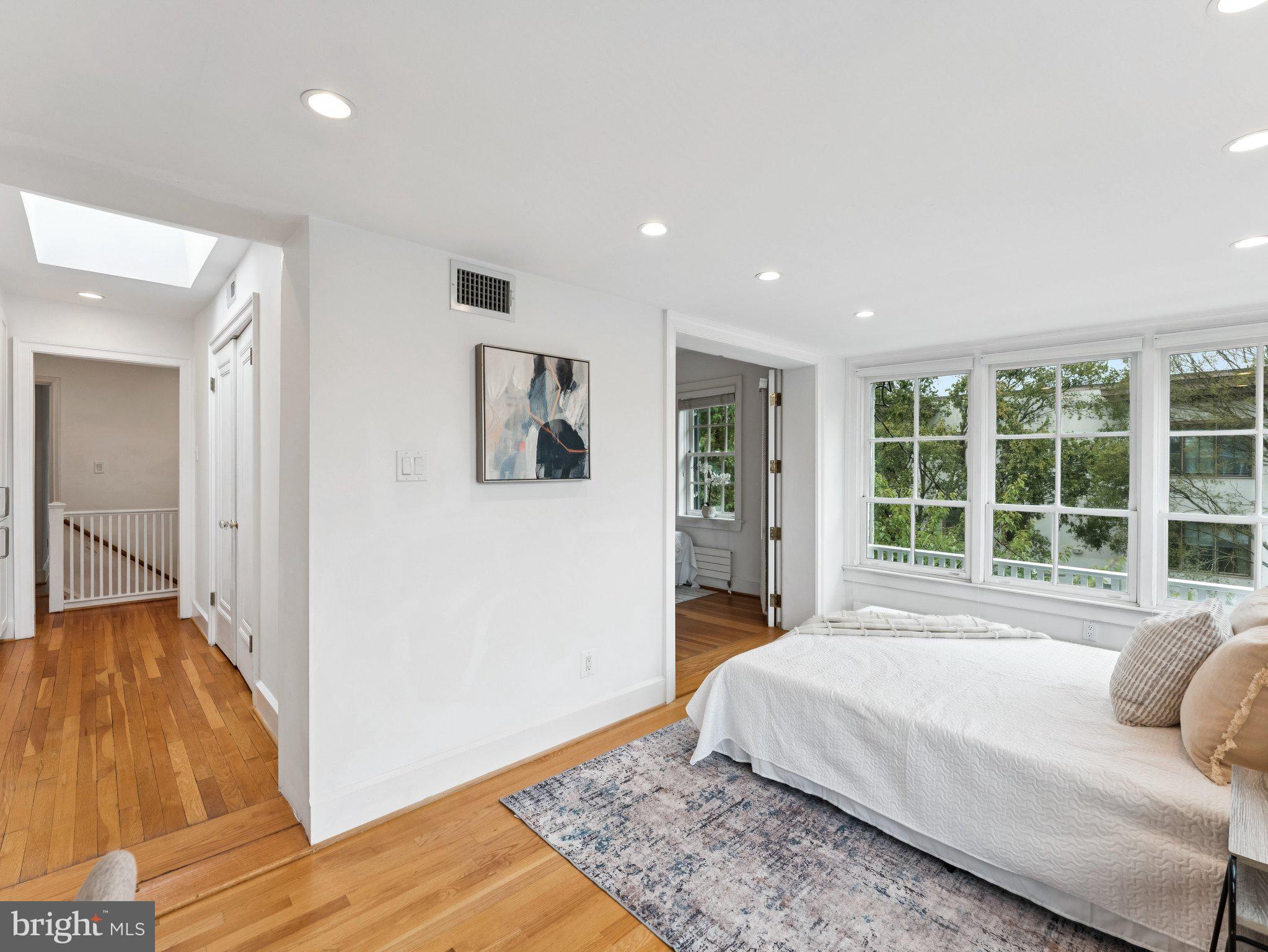 3541 R Street Northwest Washington, DC 20007 - Photo 22 of 35 a spacious bedroom with a large bed and a window