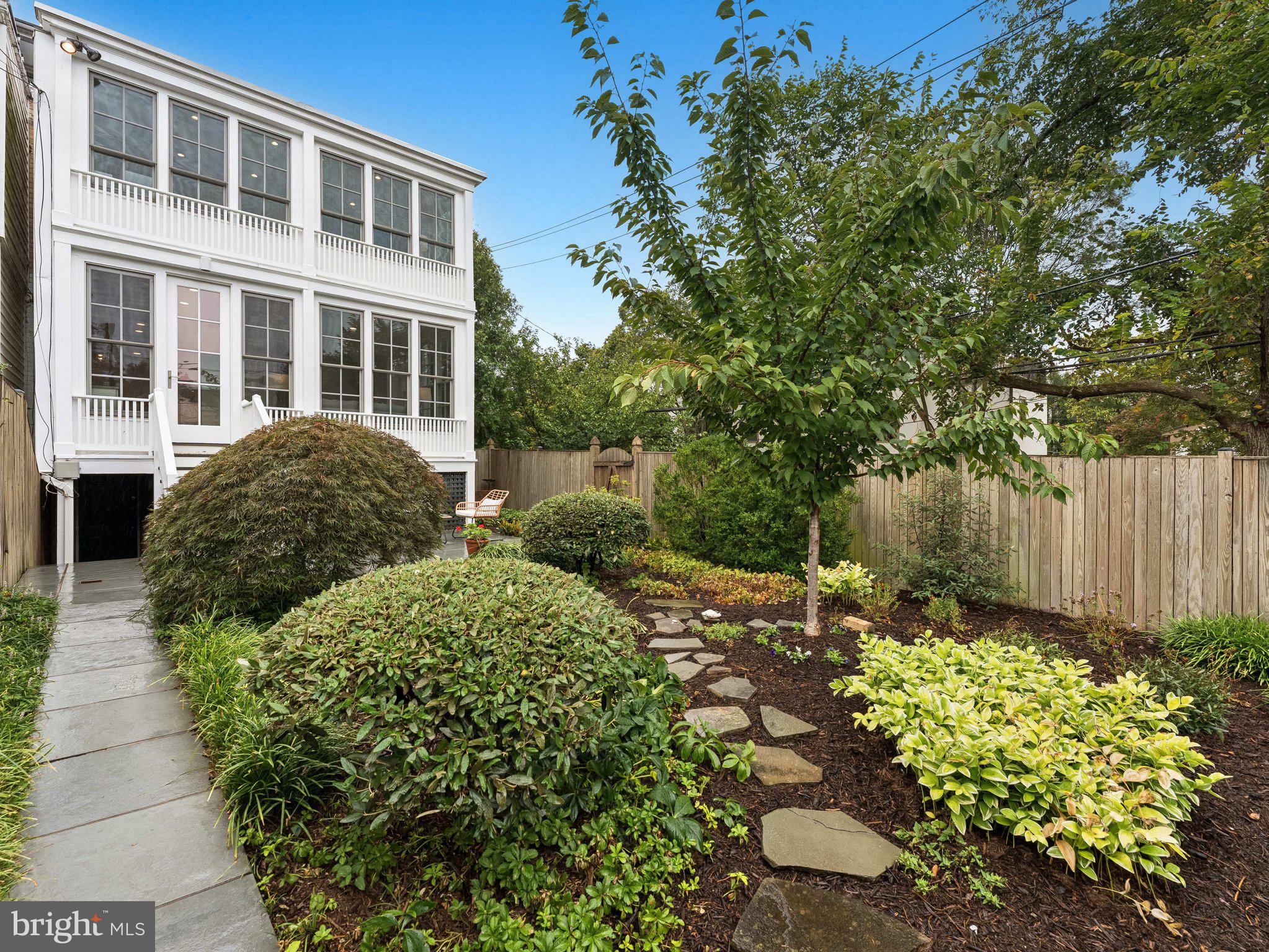 3541 R Street Northwest Washington, DC 20007 - Photo 32 of 35 a view of a house with a flower garden