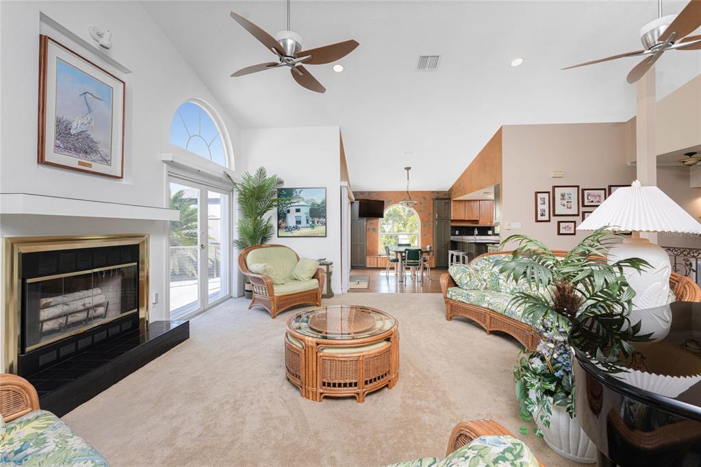 2805 North Beach Road, Unit B Englewood, FL 34223 - Photo 11 of 86 a living room with furniture and a fireplace