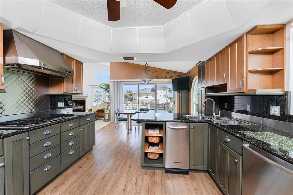 2805 North Beach Road, Unit B Englewood, FL 34223 - Photo 18 of 86 a kitchen with stainless steel appliances granite countertop a stove and a sink