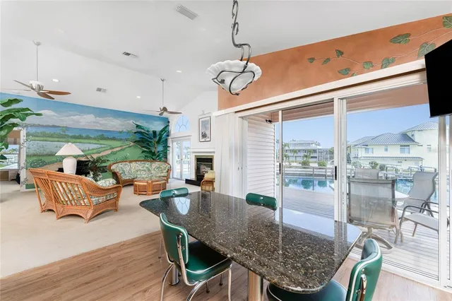 a bedroom with a bed and a large window with outer view