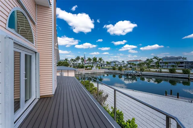 a view of a livingroom with furniture and a ceiling fan