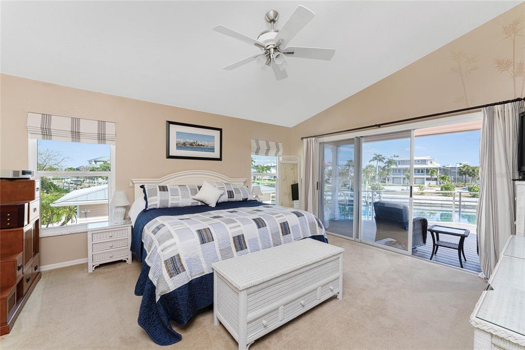 2805 North Beach Road, Unit B Englewood, FL 34223 - Photo 30 of 86 a bedroom with a bed and a large window with outer view