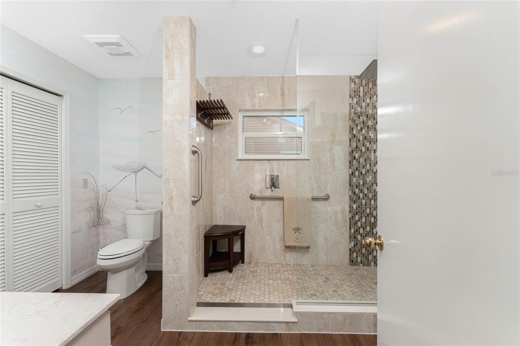 2805 North Beach Road, Unit B Englewood, FL 34223 - Photo 33 of 86 a bathroom with a shower and a toilet