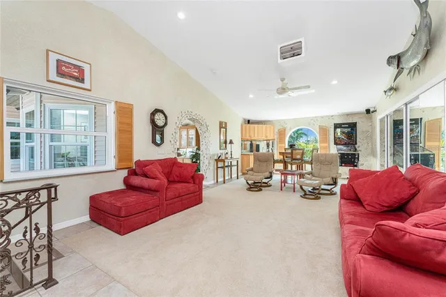 a view of a swimming pool with outdoor seating