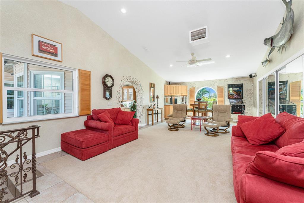 2805 North Beach Road, Unit B Englewood, FL 34223 - Photo 41 of 86 a living room with furniture and a large window