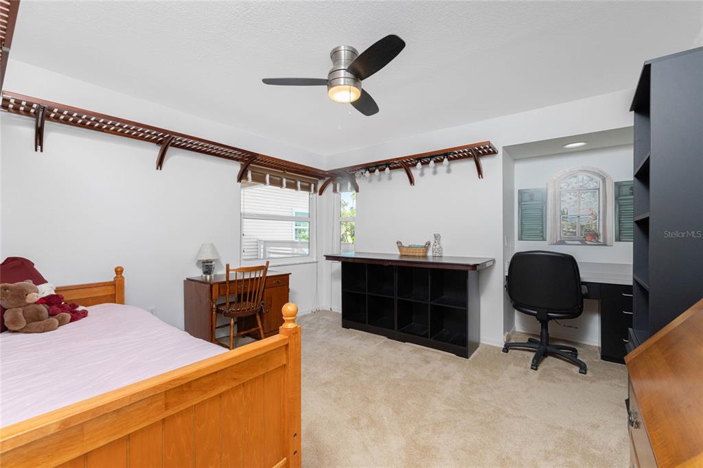 2805 North Beach Road, Unit B Englewood, FL 34223 - Photo 48 of 86 a bedroom with furniture and a window