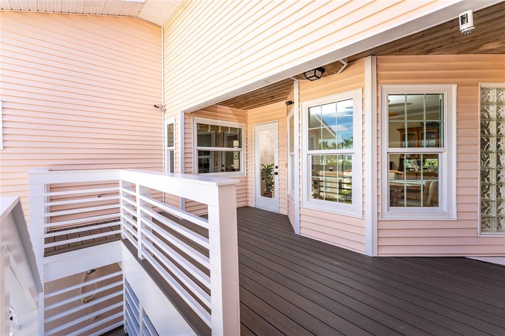 2805 North Beach Road, Unit B Englewood, FL 34223 - Photo 53 of 86 a view of a house with deck and wooden floor