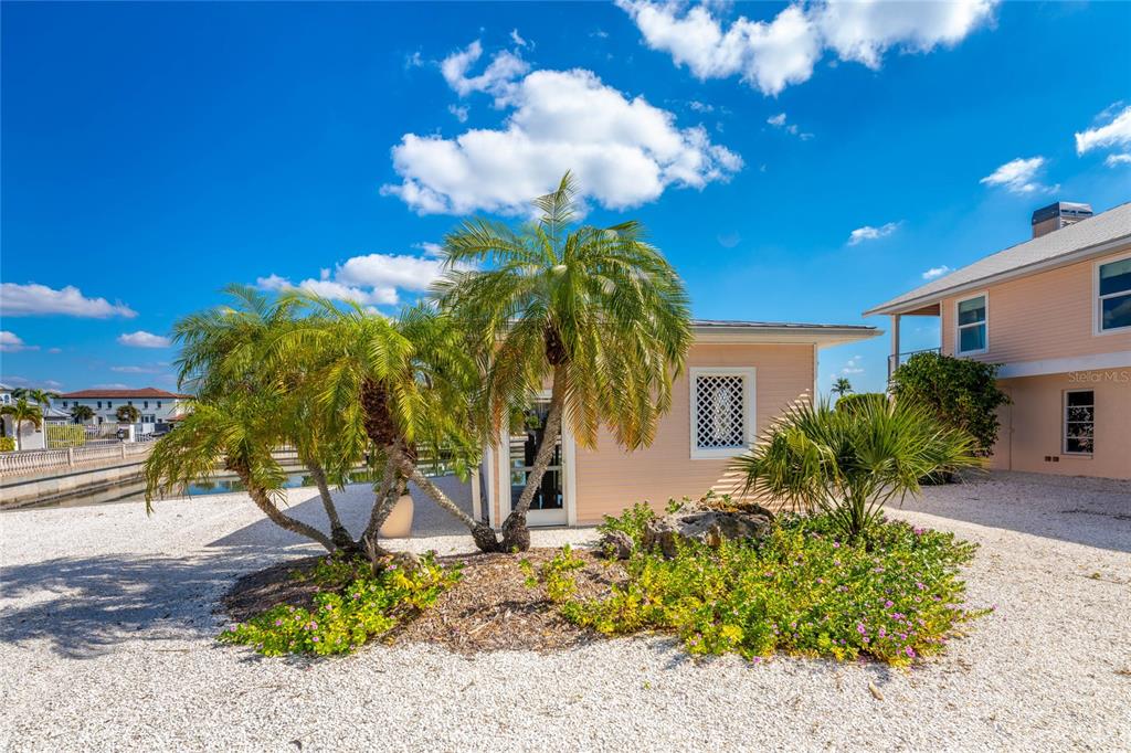 2805 North Beach Road, Unit B Englewood, FL 34223 - Photo 60 of 86 a view of a house with a yard