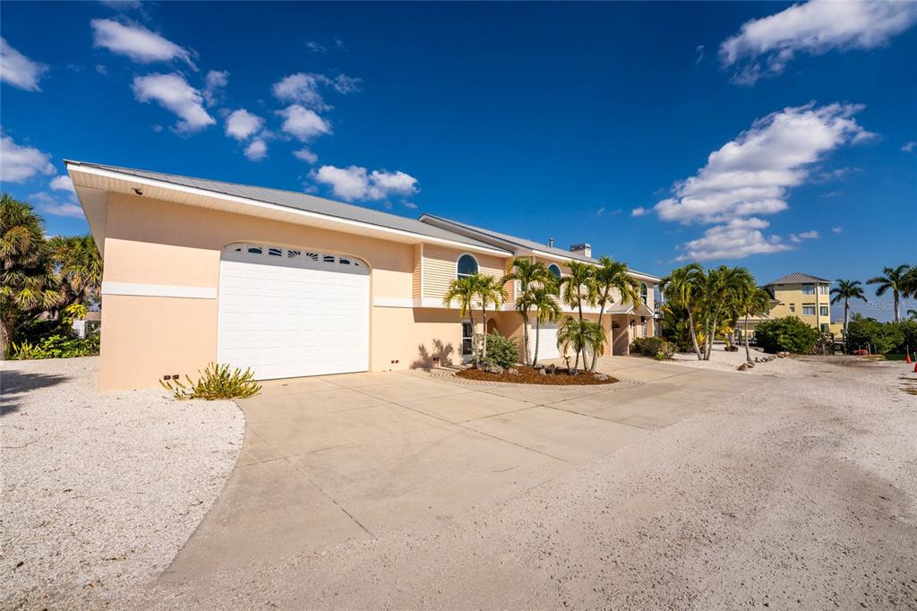 2805 North Beach Road, Unit B Englewood, FL 34223 - Photo 67 of 86 a view of a house with a outdoor space and street view