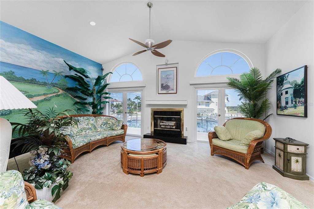 2805 North Beach Road, Unit B Englewood, FL 34223 - Photo 10 of 86 a living room with furniture fireplace and a fireplace