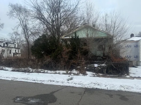 a view of a yard covered in snow
