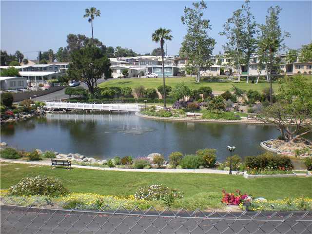 132 Brookside Lane, Unit 132 Oceanside, CA 92056 - Photo 8 of 9 VIEW OF LAKE WITH WALKING PATHS
