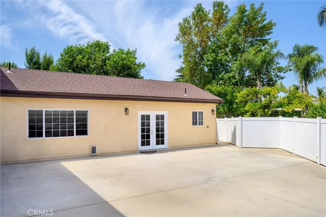 a house with trees in the background