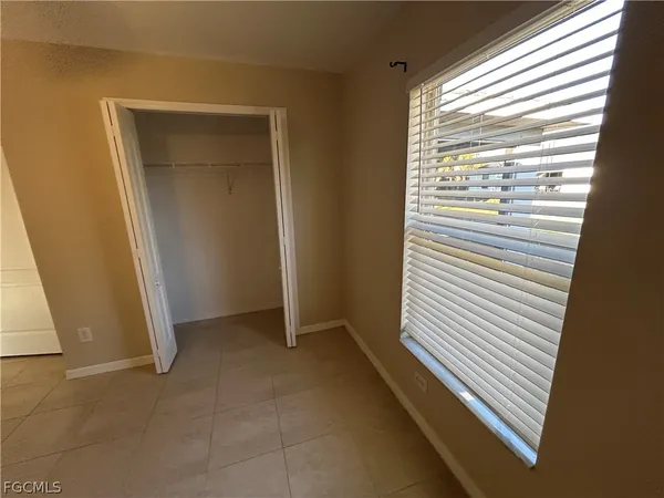 a view of a hallway and closet