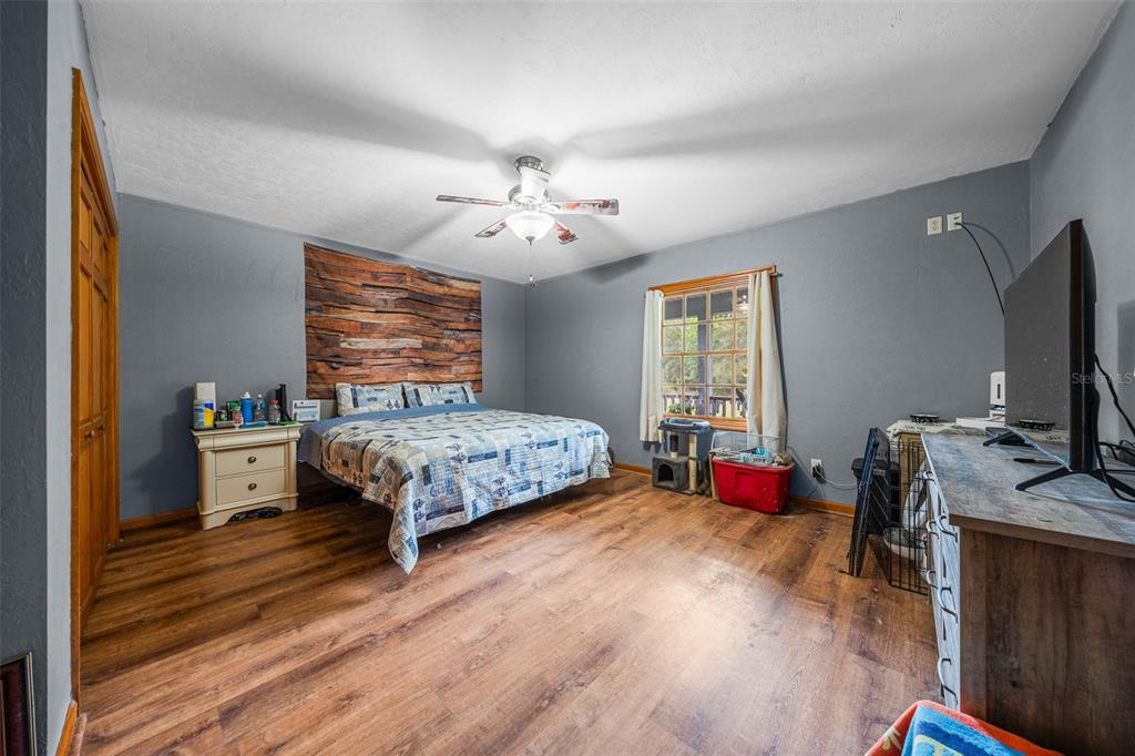 732 Carl Wilson Road Fort White, FL 32038 - Photo 24 of 80 a bedroom with a bed and a flat screen tv