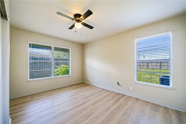 a view of a livingroom with a wooden floor and a window