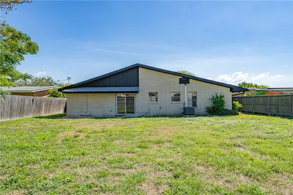 a house view with a backyard space