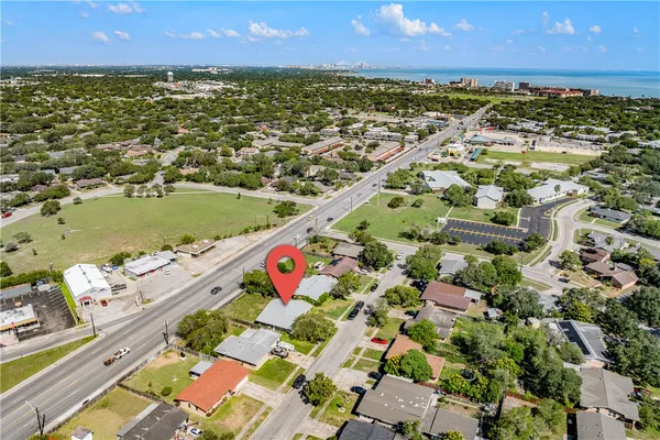 an aerial view of residential houses with outdoor space