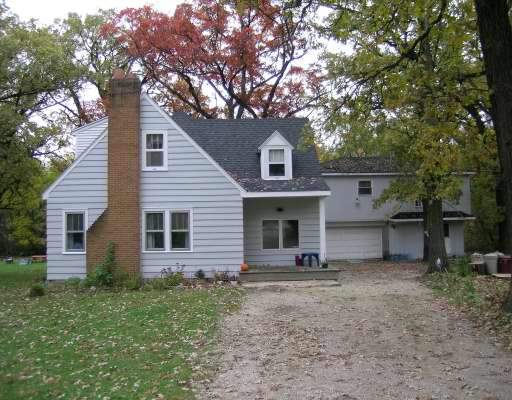 8060 West Woodvale Road Frankfort, IL 60423 - Photo 1 of 1 a view of a house with a yard and large tree