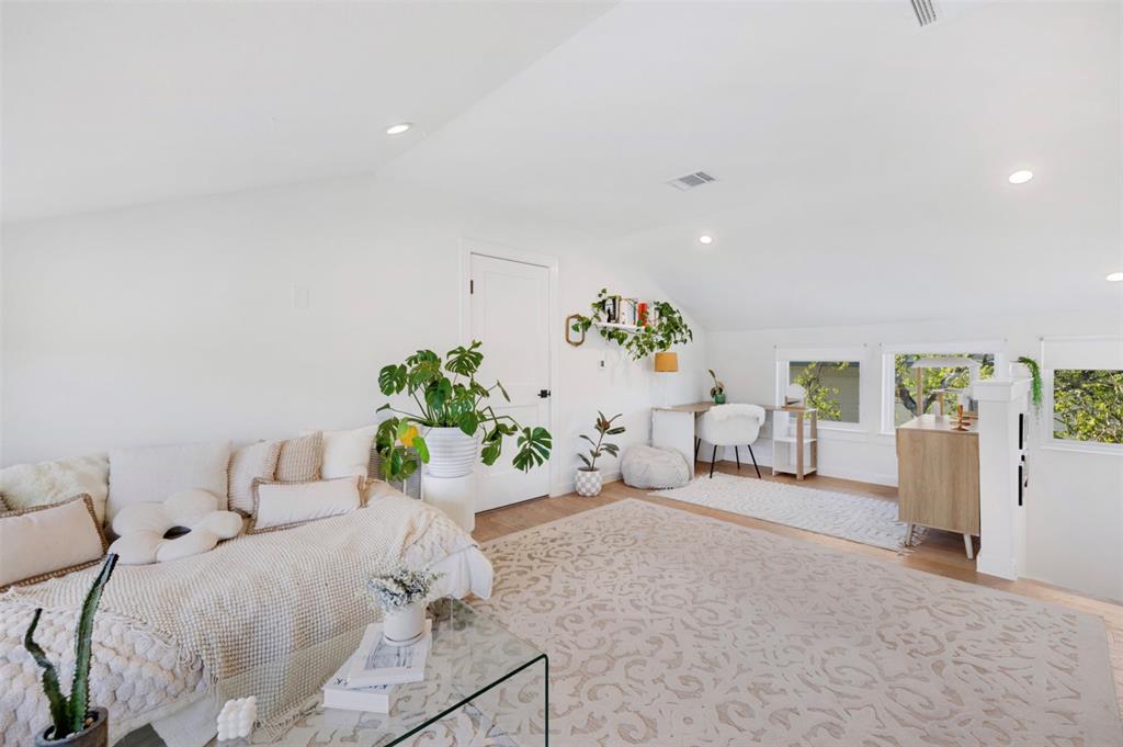 5007 Lott Avenue, Unit 1 Austin, TX 78721 - Photo 18 of 24 A versatile bonus room boasts light wood flooring, offering an ideal space for recreation or a home office.