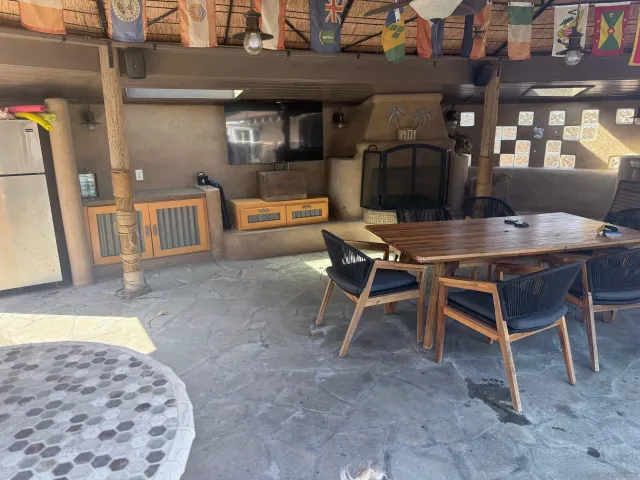 a backyard of a house with yard and outdoor seating