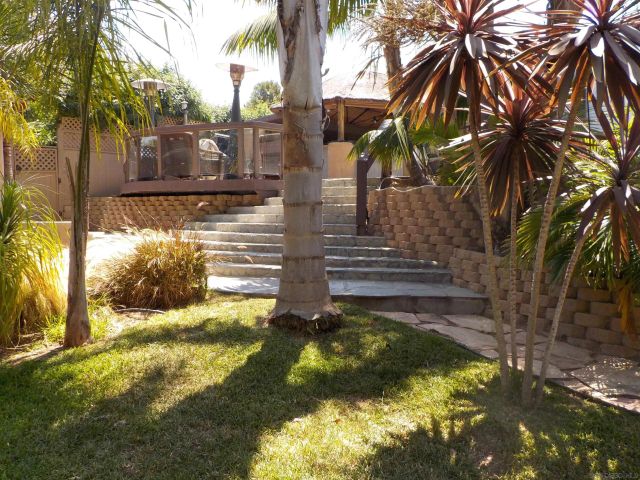 a view of a glass door with a yard