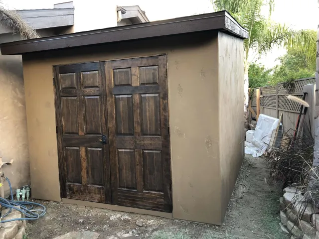 a potted plant sitting in front of a building