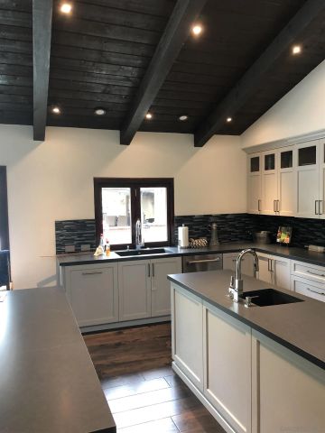 a kitchen with sink and microwave