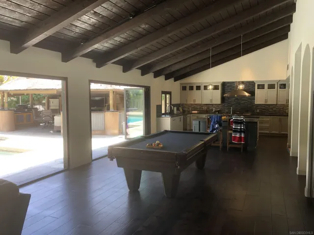 a kitchen with counter space and breakfast area