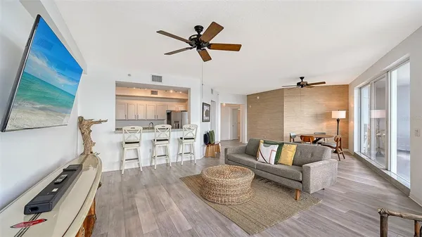 a kitchen with granite countertop white cabinets and appliances