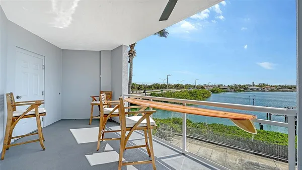 a kitchen with granite countertop white cabinets and stainless steel appliances